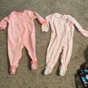 Two Carter’s footie pajamas